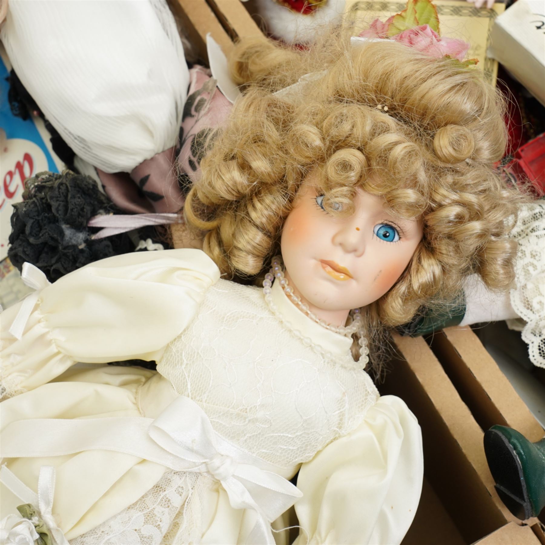 Quantity of modern dressed dolls, few die cast vehicles etc