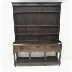 Early 19th century oak potboard dresser, raised three tier plate rack above three drawers, turned supports joined by solid undertier, W159cm, H203cm, D42cm
