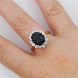 18ct gold oval cut sapphire and round brilliant cut diamond cluster ring, sapphire approx 3.30 carat, total diamond weight approx 0.85 carat