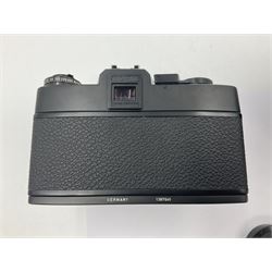 Leitz Leicaflex SL2 camera body, serial no.1387046, with 'Summicron-R 1:2/50 Leitz Wetzlar' lens, serial no. 2273397, within a leather Leitz lens hood 