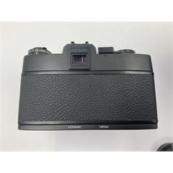 Leitz Leicaflex SL2 camera body, serial no.1387046, with 'Summicron-R 1:2/50 Leitz Wetzlar' lens, serial no. 2273397, within a leather Leitz lens hood 