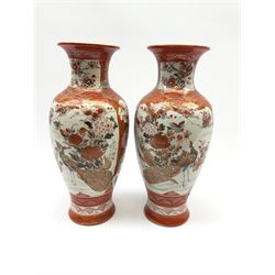 A pair of Japanese Kutani vases, of baluster form decorated with panels of birds and flowers, each with marks beneath, H30cm. 