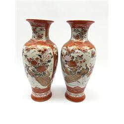 A pair of Japanese Kutani vases, of baluster form decorated with panels of birds and flowers, each with marks beneath, H30cm. 