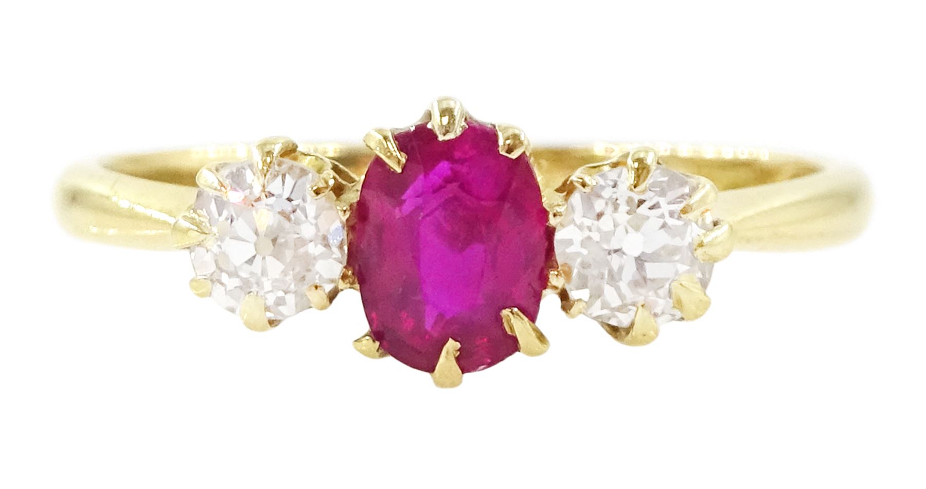 Victorian 18ct gold ruby and diamond three stone ring, single oval cut ruby of approx 0.45 carat, with a single old cut diamond set either side, Birmingham 1898, total diamond weight approx 0.35 carat