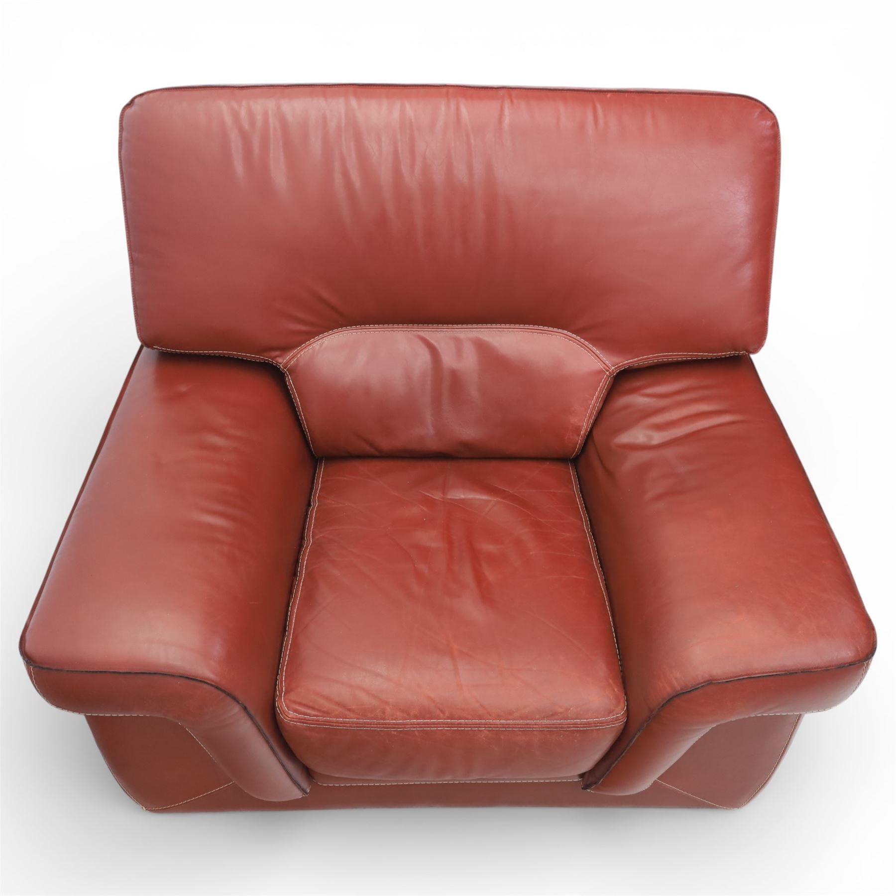 Fabrizio Mantellassi - 20th century Italian red leather suite, one three seat and two large armchairs, upholstered in deep red hide with stitched seam detailing, with magazine pockets to each side, the rectangular back cushions above broad padded arms and seat cushions, raised on low block bases

Sofa: H c98m, W 203cm, D 92cm
Armchair: H 98cm, W 113cm, D 92cm