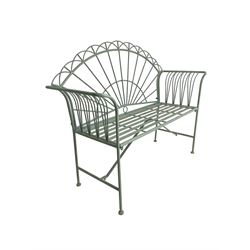 Regency design wrought metal bench, the fan back over out-swept arms, strap seat on supports united by stretchers, in pale teal finish