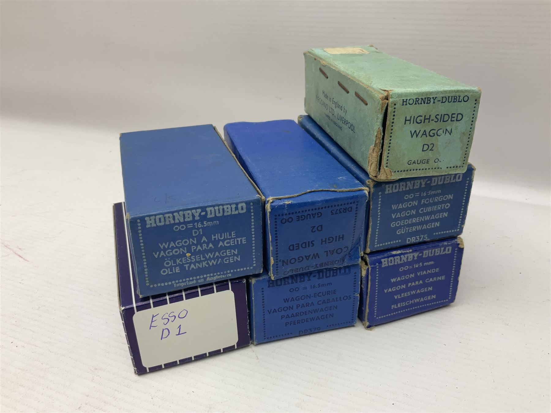 Hornby Dublo - nineteen goods wagons comprising 32040 Goods Van D1 (SR) in LMS stickered box, DR375 Goods Van D1 (GW), D303 Open Goods Wagon D1 (GW), 32044, 32076, 32052, 32021, 32074, 32056, 32065, DR379, 32070, 32020, DR373, two x 32075, High Sided Wagon D2 (LMS) in NE stickered box; all boxed; Tank Wagon D1 (Esso) and DR380 Meat Van D1; both in later unassociated boxes (19)