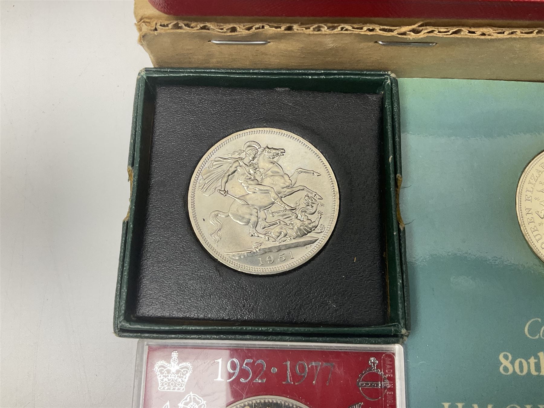 Coins including two King George VI 1951 Festival of Britain crowns each in green case, various other commemorative crowns, two Iceland '874-1974' two coin sets both in original red cases etc