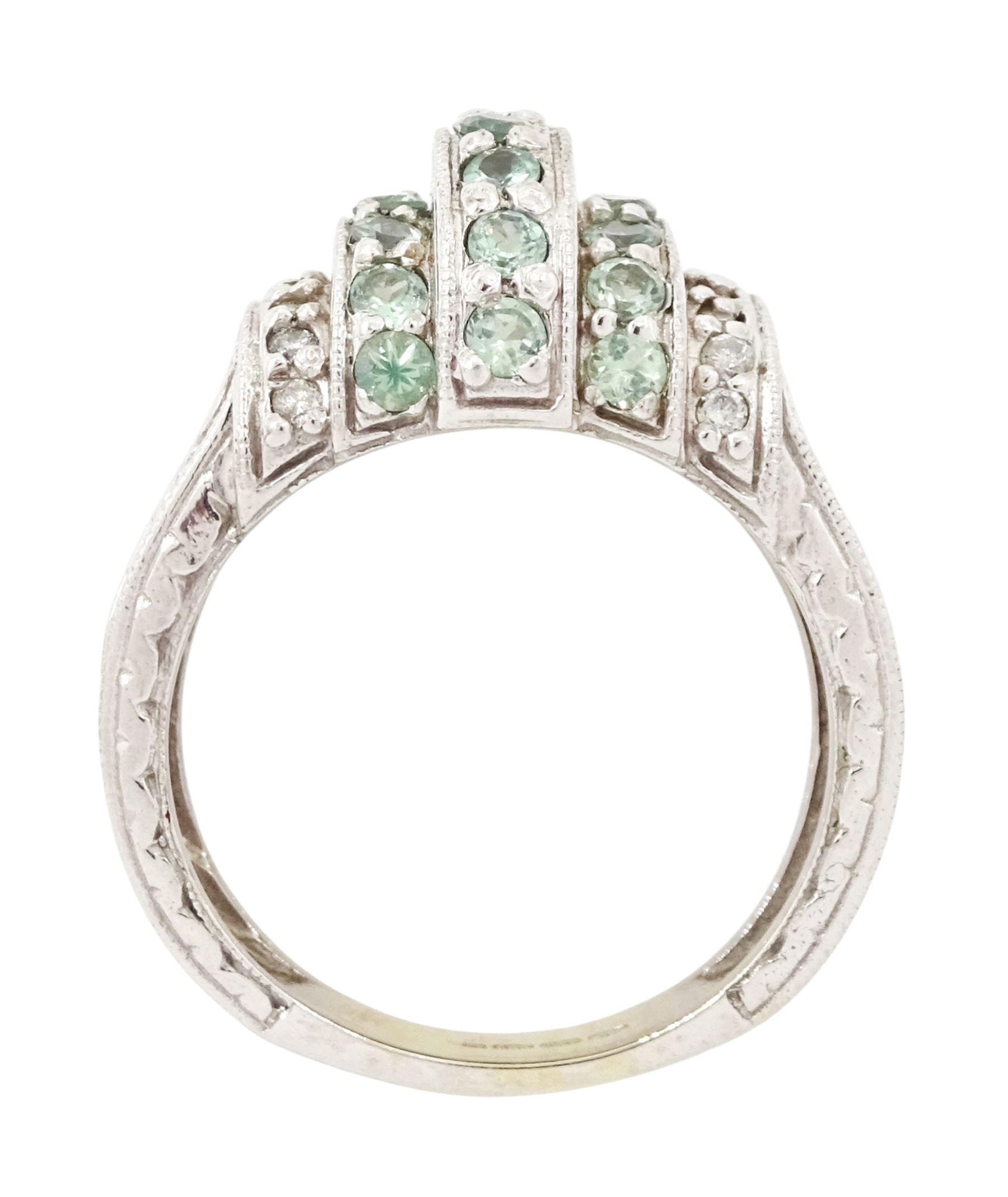 14ct white gold alexandrite and diamond stepped design ring, three rows of round cut alexandrite's, with a row of single cut diamonds either side, the shoulders with engraved foliate decoration, hallmarked