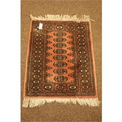  Gold and ivory ground Kilim rug, geometric design with Greek key border (140cm x 202cm), peach ground Tekke Bokhara rug, two red ground Persian design rugs and two green ground rugs  