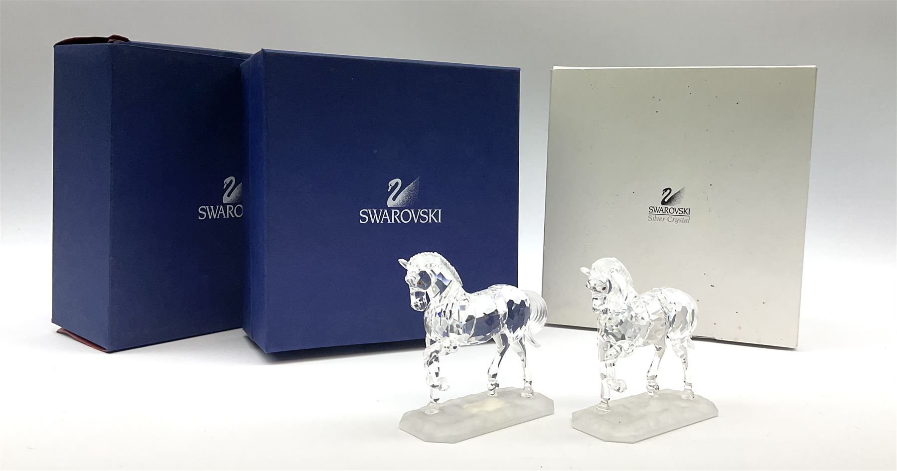A pair of Swarovski Crystal horses H9.5cm, in original boxes