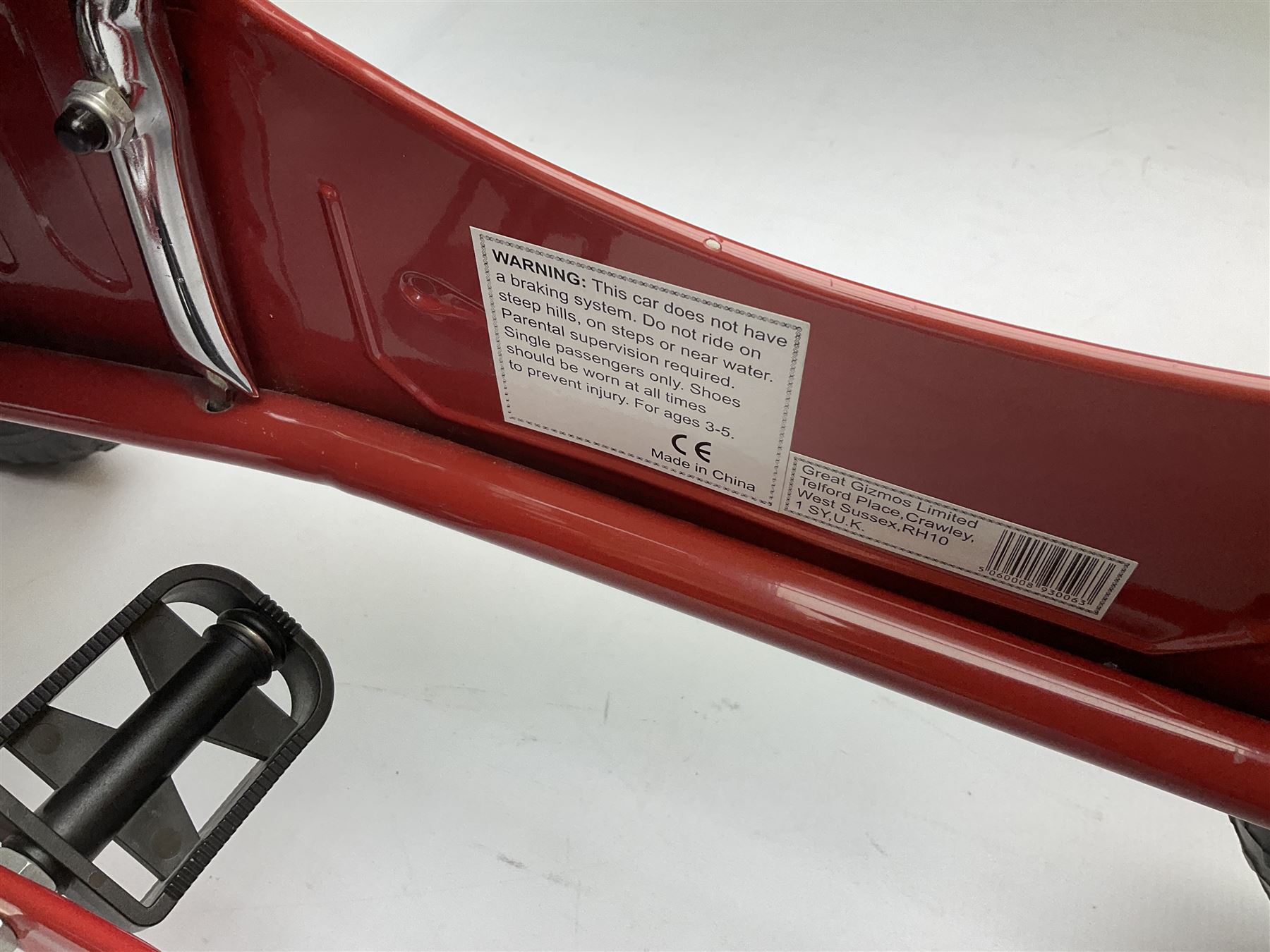 Red child's tin-plate pedal car with chrome detail, by Posh Paddles, Scarborough, H56cm, L80cm