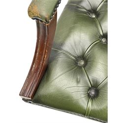 Georgian design swivel office desk chair, upholstered in buttoned green leather, on five spoke base with castors 
