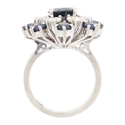 18ct white gold sapphire and diamond cluster ring, single oval cut sapphire of approx 1.85 carat, surrounded by eight round brilliant cut diamonds and eight round cut sapphires, stamped Graff, total sapphire weight approx 3.40 carat, total diamond weight approx 1.35 carat