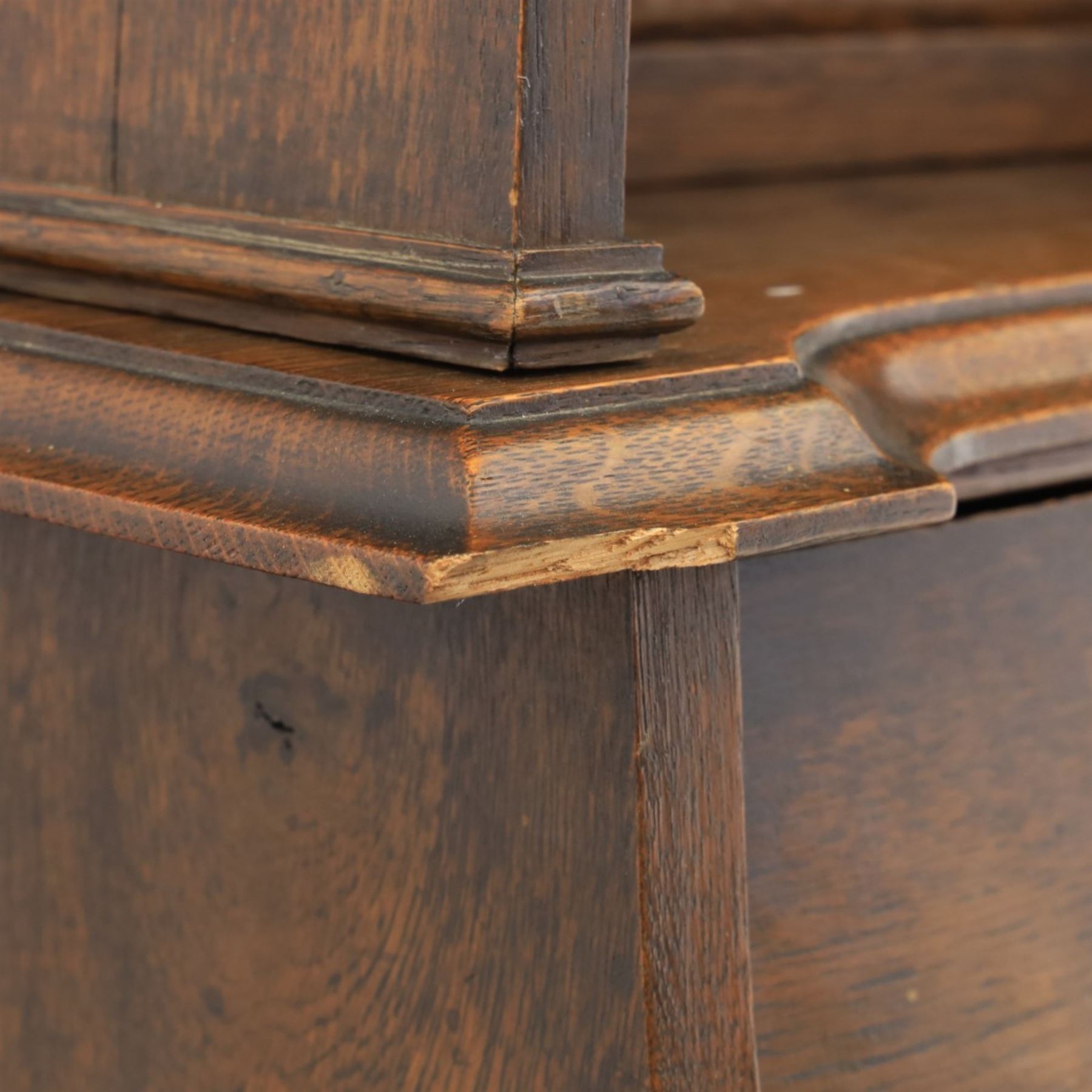 Arts & Crafts oak bureau bookcase, projecting cornice with leaded and glazed upper cabinet, the lower section with fall front section revealing a fitted interior, above shaped lower shelving 
