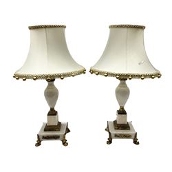 Pair of 20th century marble effect table lamps with gilded decoration, with tasselled fabric shades, H45cm