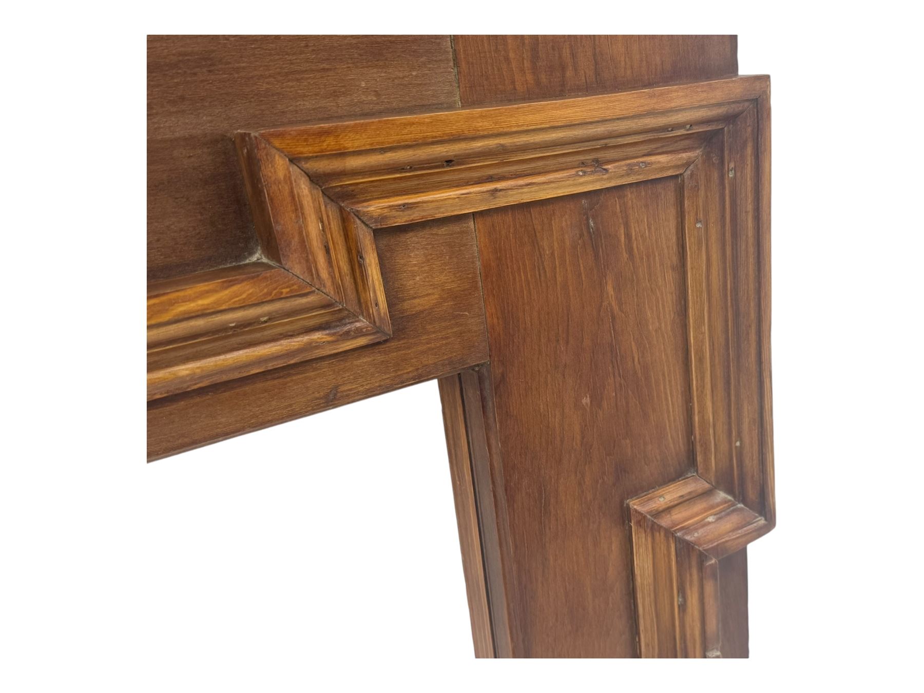 Victorian stained pine fire surround, projecting cornice with dentil moulding, panelled frieze and chamfered uprights on block supports