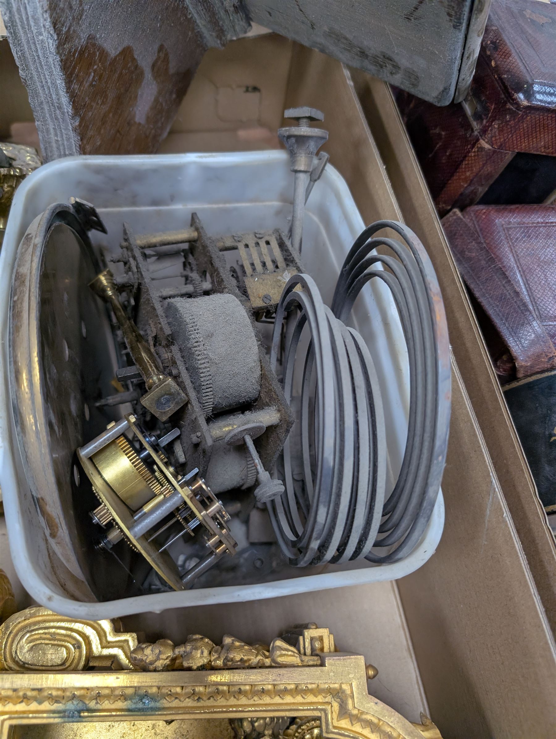 Collection of leather carriage clock cases, brass mantle clocks and parts, brass candlesticks etc, in two boxes