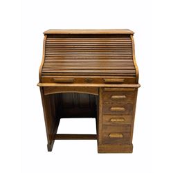 Early 20th century roll top desk, single pedestal fitted with four graduating drawers