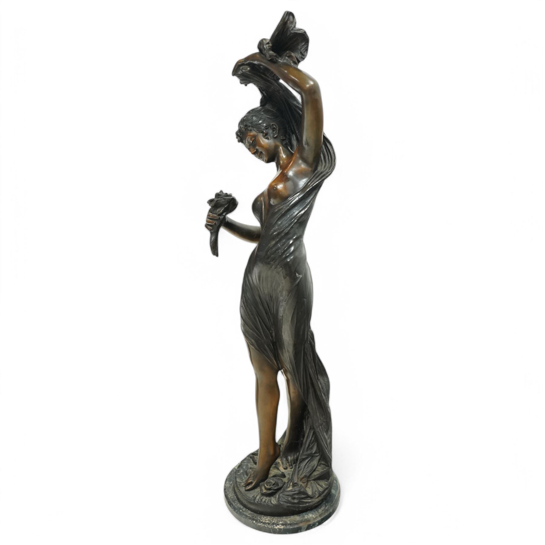 Giorgio Ceragioli (Italian 1861-1947): 'Danza Del Flori' -The Flower Dancer, large patinated bronze figure of a female dancer draped in a flowing garment and holding a rose, on a circular naturalistic floral base, on a marble plinth, signed and dated 1910, titled to the front, H140cm