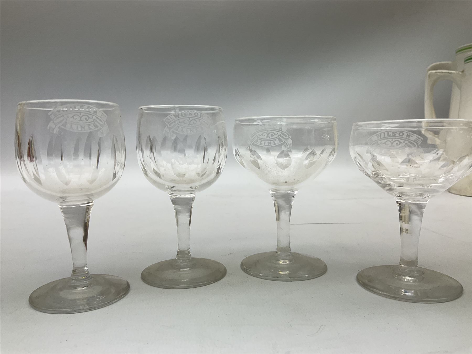 Wilson Line of Hull - five graduated ceramic jugs by Weatherby, Adams and Crown Ducal, largest H22cm, sets of six port and liqueur glasses, four silver plated menu holders and glass ashtray (22)  
