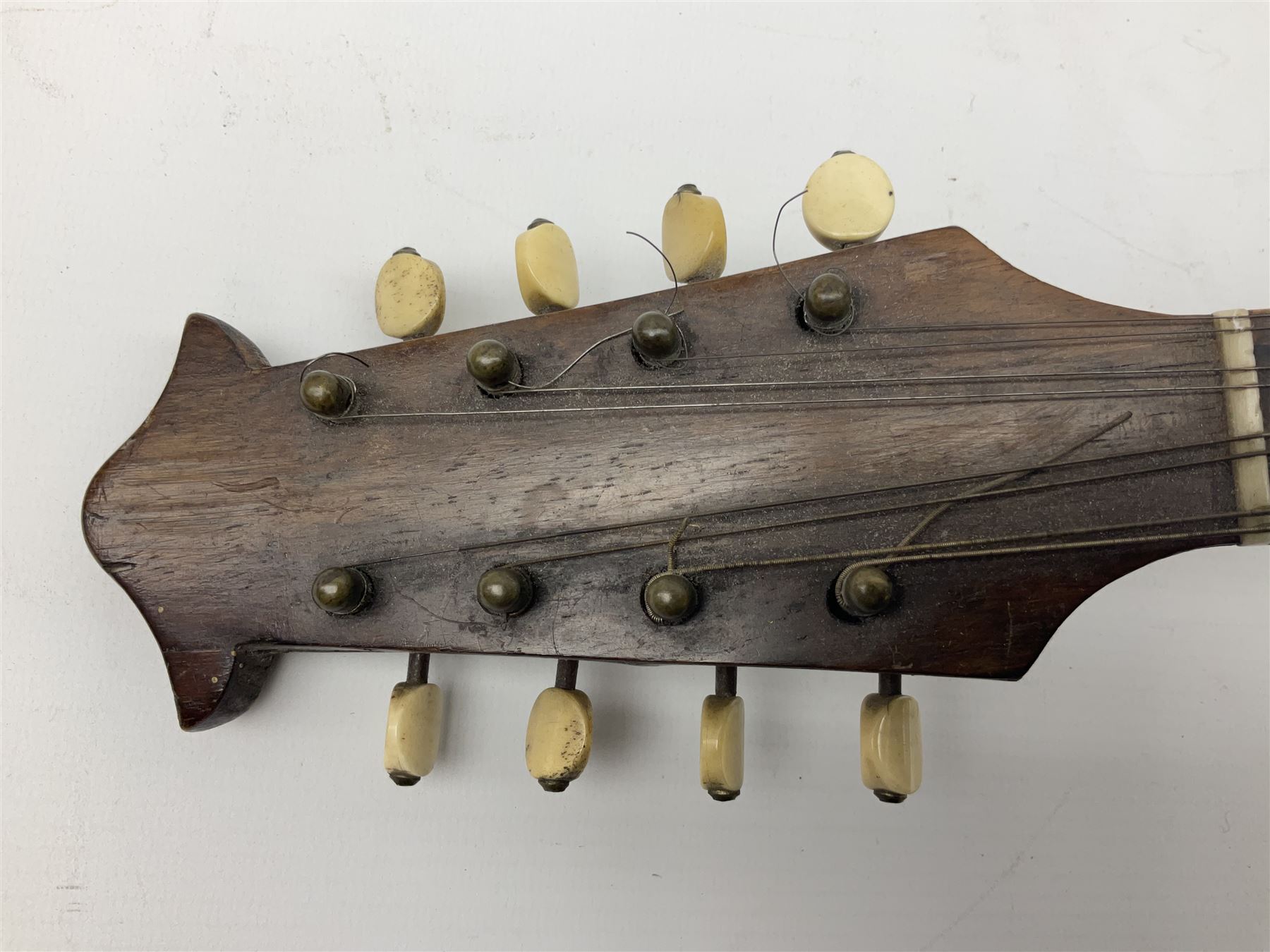 Italian mandolin, with foliate inlaid scratchplate, paper label inscribed 'Carlo Loveri & Figlio of Napoli', L62cm