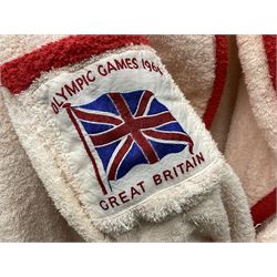 On the direct instructions of Anita Porter nee Lonsbrough Great British Olympic and Commonwealth Games gold medal winning swimmer - collection of early and international memorabilia comprising original Huddersfield Bath Club track suit top bearing eight stitched on cloth badges including British Empire & Commonwealth Games 1958 England Team, YSASA, North Eastern Counties ASA, ESSA Division 3,  English Schools Swimming Association winner etc
The swimming costume Anita wore at the 1958 Commonwealth Games in Cardiff, her first major championships, where she won two gold medals. The grey elastic on the sides, in those days, she would use to make it tighter and more streamlined.
Blue track suit from the 1960 Olympics which she wore on the podium receiving the gold medal.
1960 pool side towelling robe used at the Rome Olympics (interesting to note her name is spelt wrong on the embroidered label).
1962 Commonwealth Games pool side towelling robe used in Perth Australia when winning three Gold medals. 
It was also this year she became BBC Sports Personality of the year, the first female to do so.
Her 'lucky' pool side towel which she took with her to every event she competed in and which can be seen round her neck in many official celebratory photographs. Copies of some of these photographs are included for identification.
In addition there are two souvenir programmes of an evening event to honour Anita at The Theatre Royal Huddersfield and she has kindly signed the front cover on one of these.