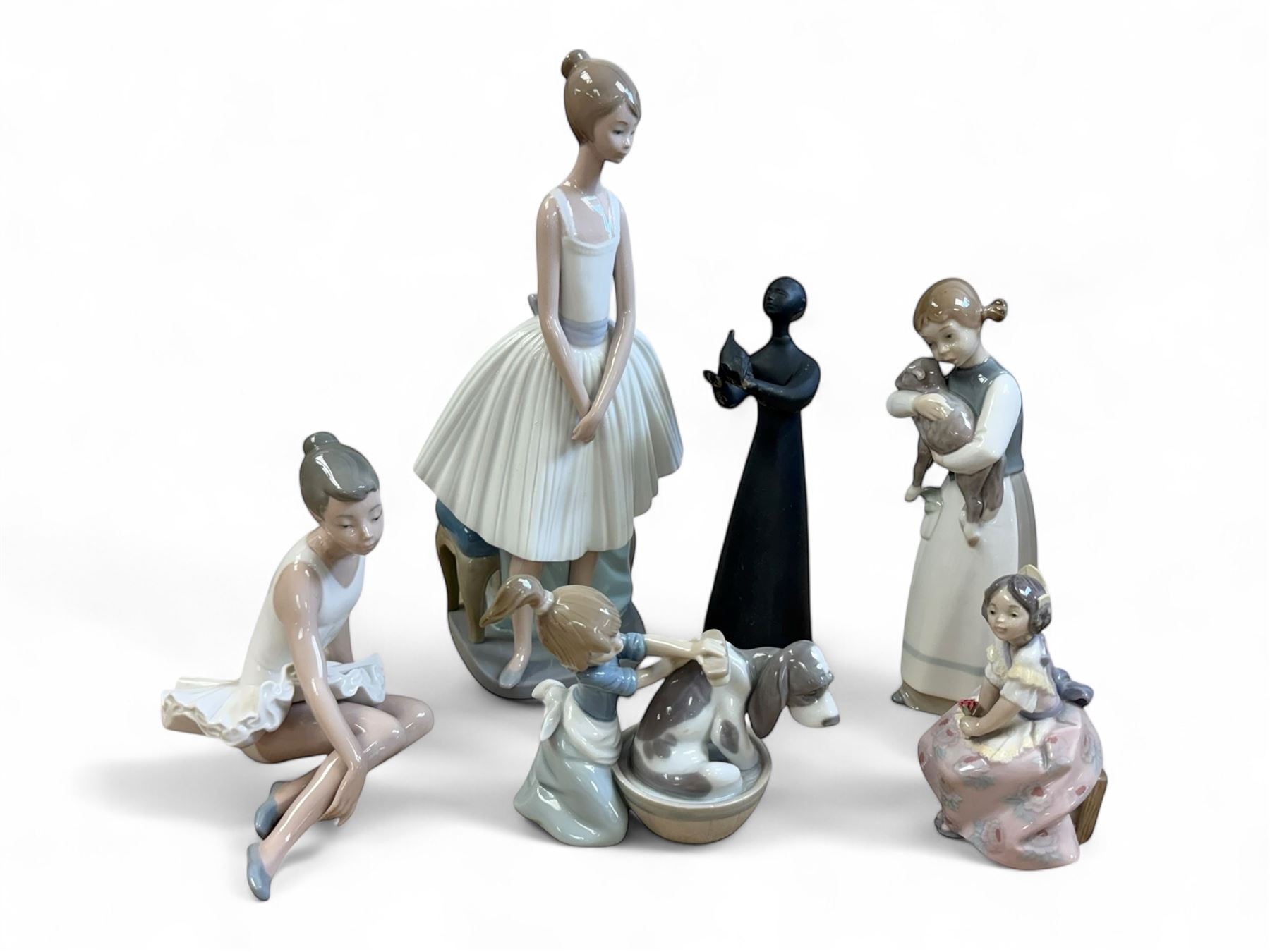 Three Lladro figures, Bashful Bather 5455, Pepita no 5372 and girl with lamb no 1010, together with two Neo figures and a Royal Doulton figure 