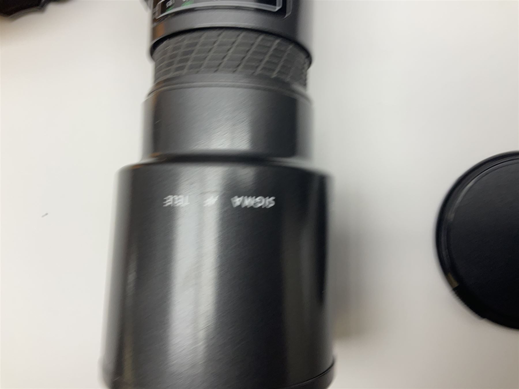 Four camera bodies, to include, Ricoh KR-10 serial no. 38826, Pentax MZ-M serial no. 4185969 with 'SMC Pentax- M 1:3.5 28mm' lens, Canon EOS500 serial no. 080927, with 'Sigma Zoom 100-300mm 1:4.5-6.7 DL'  lens etc, with other camera lenses and equipment 