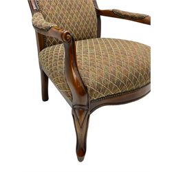 Stained beech framed open armchair, upholstered in foliate pattern fabric, on cabriole front supports