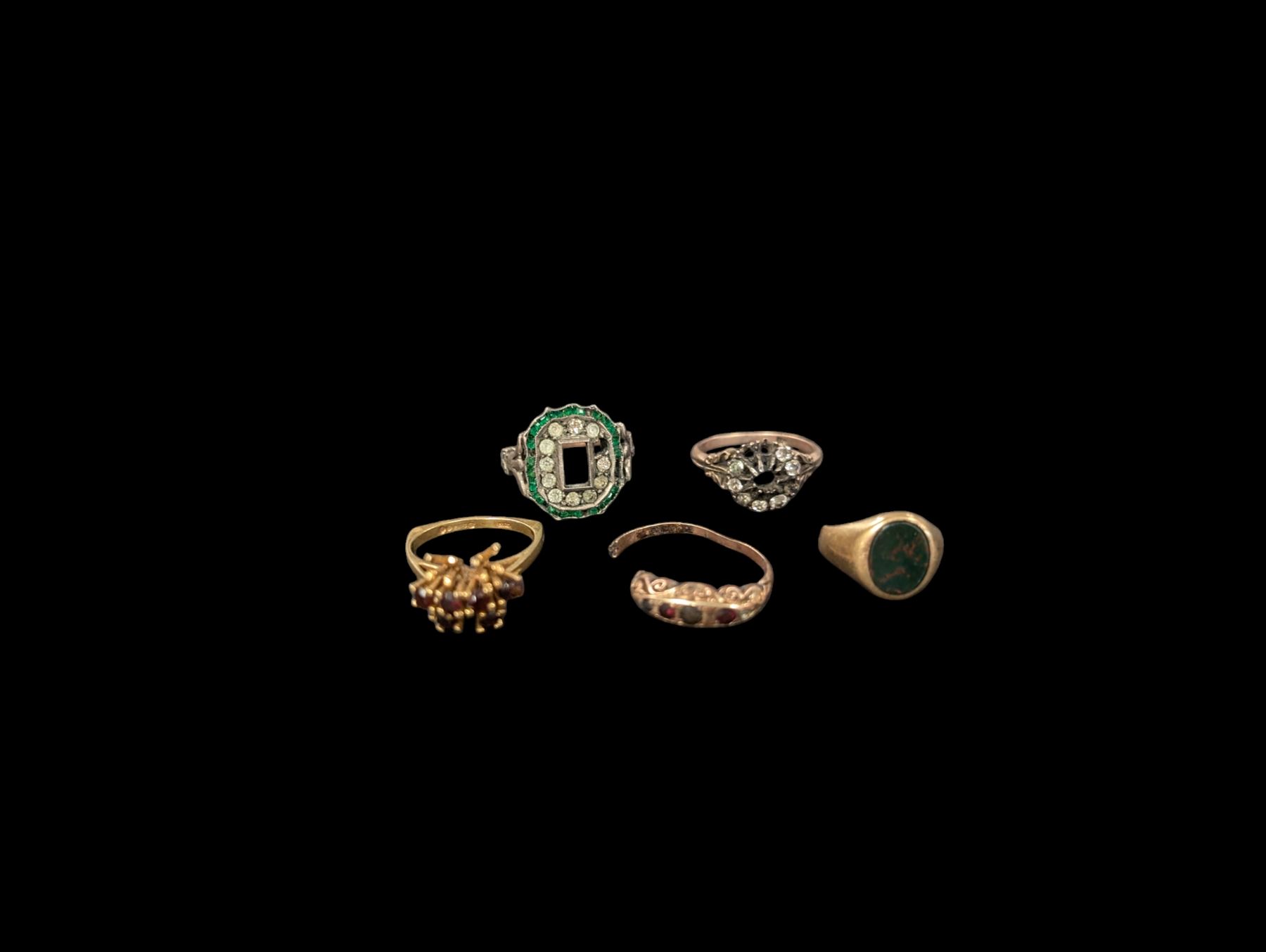 Five 9ct gold rings, all stone set and with split/bent/missing bands