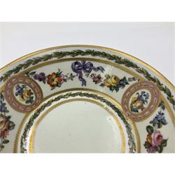 Sèvres soft paste porcelain coffee can and saucer with date code for 1780, painted with pink oval panels bordering bouquets of flowers, united by swags of flowers tied with purple ribbons, within laurel leaf borders, interlaced LL monogram enclosing date letters CC above painters marks for Nicquet, coffee can H7.5cm, saucer D15cm