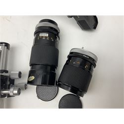 Collection of Canon lenses, to include 'Canon Lens FD 100mm 1:2.8', serial no 12821, 'Canon Lens FD 200mm 1:4' serial no 245313, 'Macro Canon Lens FL 50mm 1:3.5', serial no. 25505, 'Canon Lens FD 135mm 1:3.5 etc, together with other Canon equipment, including Bellows FL, Slide Duplicator etc 