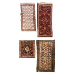 Collection of four Persian rugs, comprising a Saraband ivory ground rug with all-over bote...