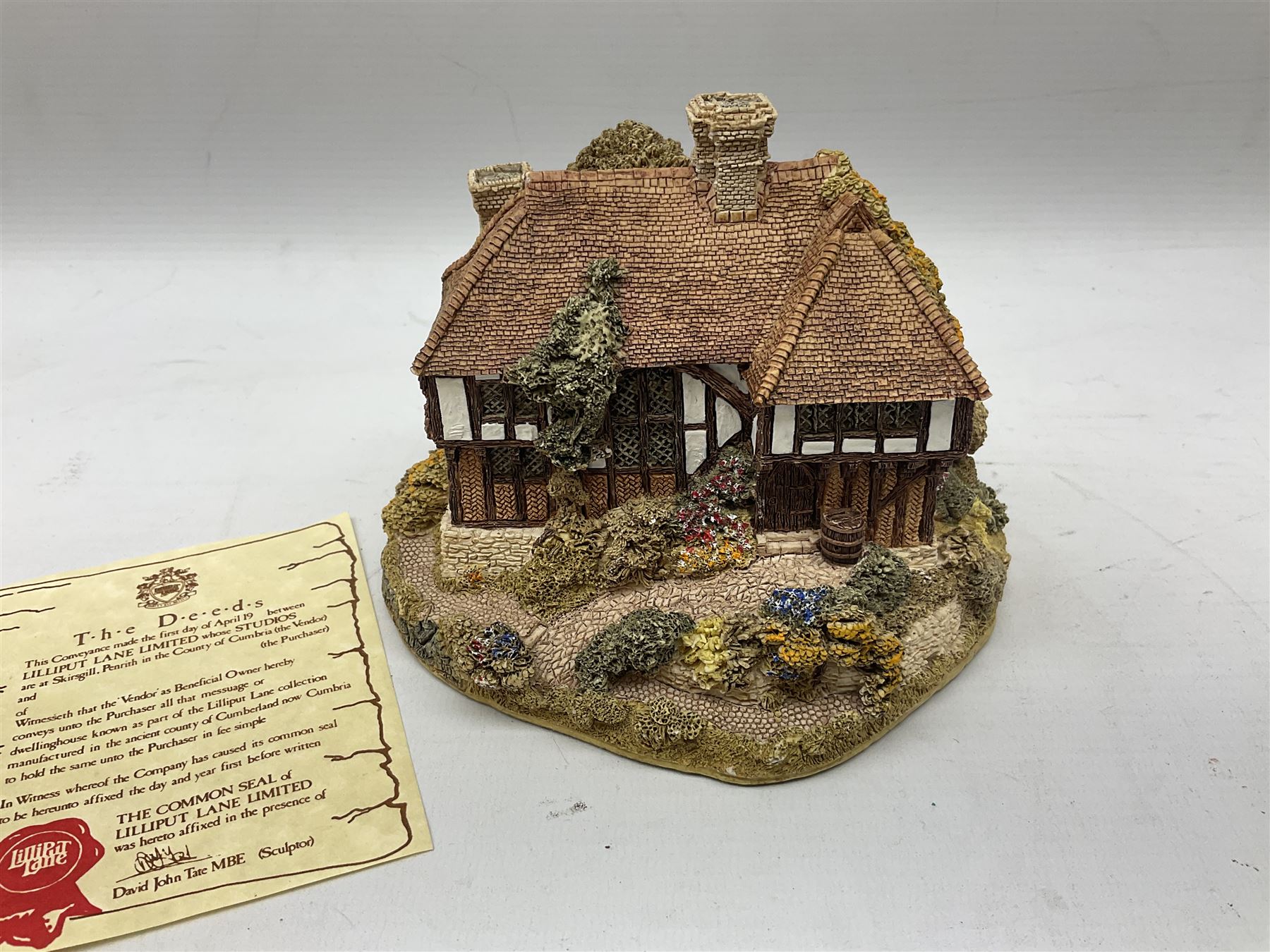 Nine Lilliput Lane cottages from the British and English collections to include Crown Inn, Wealden House, Puffin Row, etc, all boxed, one without deeds