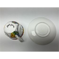 Modern studio pottery by Josie Firmin, to include cup and saucer, three espresso cups and saucers, pair of egg cups etc, each hand painted with varying cartoon cat designs