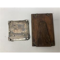 Edwardian silver stand, of square shaped form, upon four bun feet, hallmarked Birmingham 1907, together with an early 20th century silver mounted photograph frame, hallmarked Birmingham 1918, approximate weighable silver 93.6 grams