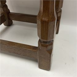 Yorkshire Oak - small oak stool, leather latticework seat on octagonal supports united by stretchers, the front stretcher carved with Yorkshire Rose motif