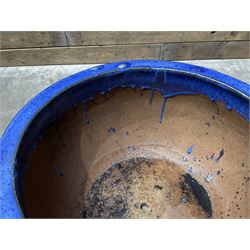 Cast iron cauldron set pot with 2 terracotta chimney pots and 2 terracotta planters,