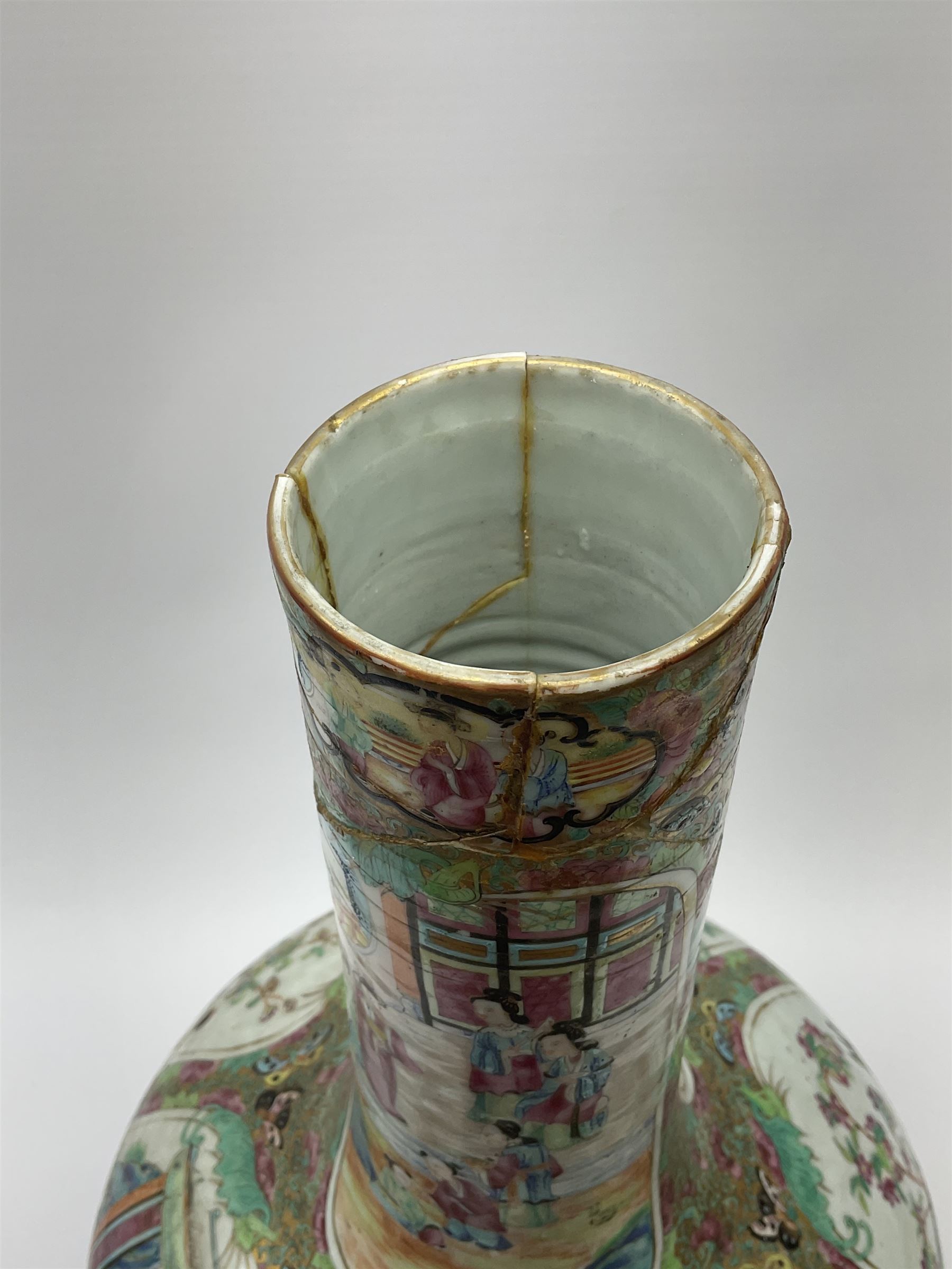 A 19th century Chinese Canton Famille Rose vase, of globular form with tall neck, and cover with finial, decorated with alternating panels of figural scenes, and birds and butterflies amongst blossoming and fruiting trees, with foliate surround against gilt, overall H57cm. 