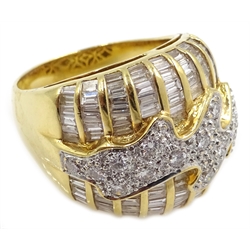  Heavy 18ct gold baguette and round brilliant cut diamond ring, with central wave design, stamped 750  