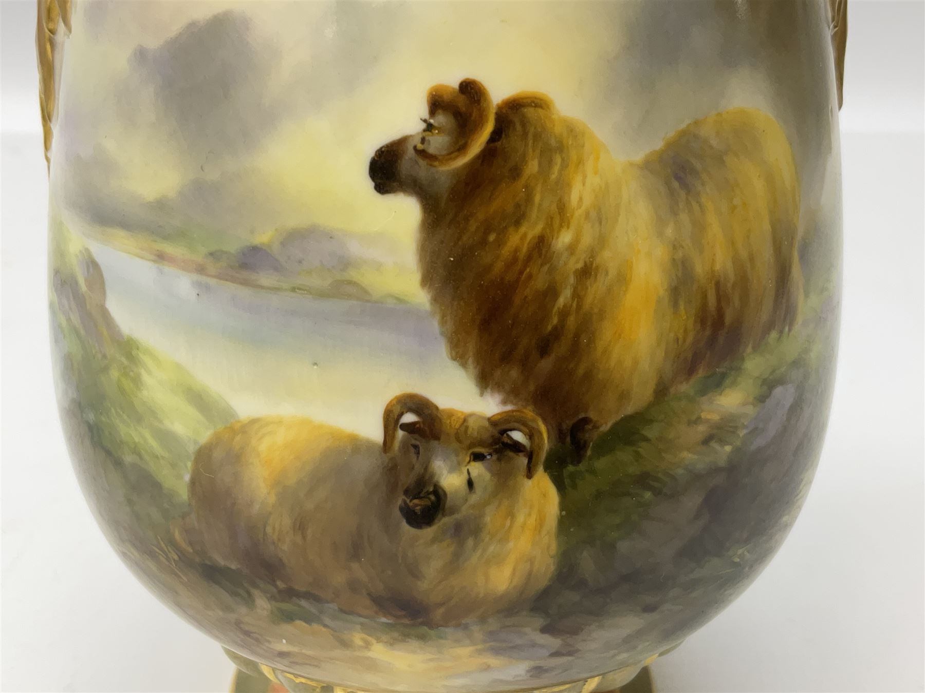 Early 20th century Royal Worcester vase decorated by Harry Davis, of ovoid form with twin acanthus mounted handles and waisted high neck supporting a domed cover, upon a circular foot, the body hand painted with sheep in a highland landscape, signed H Davis, with puce printed marks beneath including shape number 2425, and date code for 1907, H27.5cm