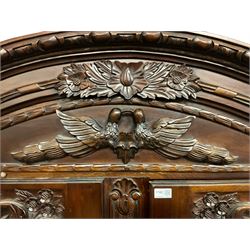 French style mahogany double wardrobe, shaped pediment carved with flower heads and bird mount, enclosed by two panelled doors with floral decoration, scrolled feet