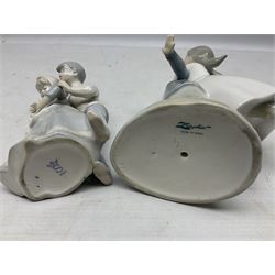 Three Nao figures comprising The Next Dance 1201 and Girls First Communion 0236, and young girl wearing a hat, together with two further Spanish style figures