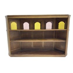 Old Charm - canted oak drinks bar, arched apertures set with mottled and bullseye colour glass panes, and three stools