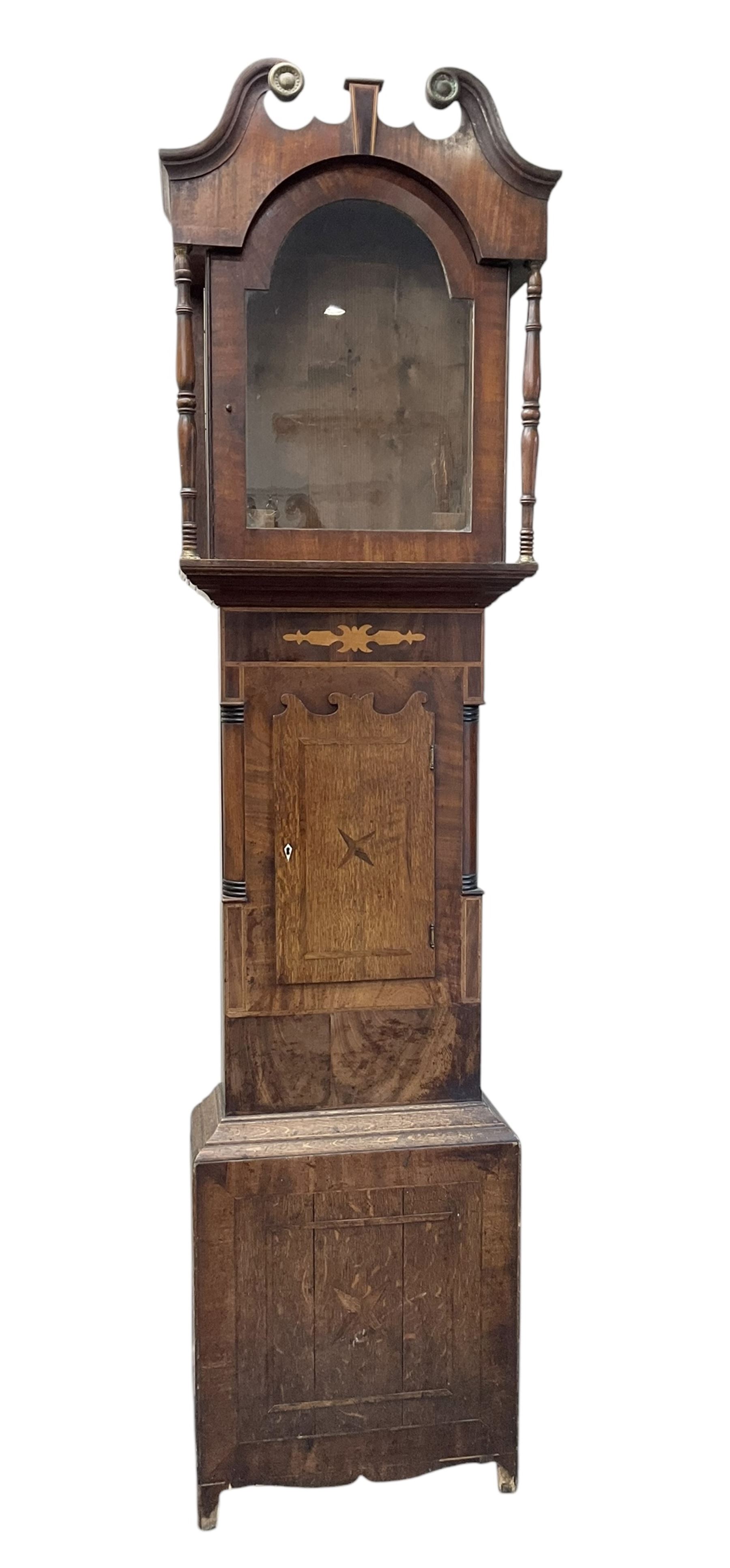 D Hudson of Otley - late 19th century 30 hour oak and mahogany longcase clock, with a swan necked pediment, break arch hood door and ring turned pilasters, inlaid trunk with recessed columns and a short trunk door with inlay and a bone escutcheon, rectangular conforming plinth with a shaped base,  painted dial with geometric spandrels and a depiction of  Britannia to the arch, broad Roman numerals, makers name and calendar dial, dial pinned directly to a chain driven countwheel striking movement, striking the hours on a bell. with pendulum. No weight or movement seat board.