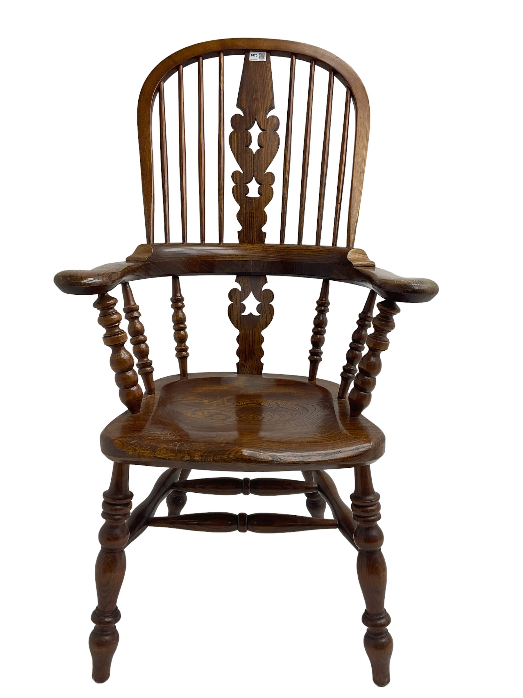 Traditional elm Yorkshire style Windsor armchair, high back with pierced and fret work splat, turned supports joined by double H stretcher