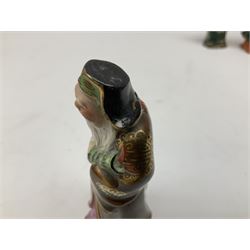 Japanese parquetry puzzle box L12cm; another Japanese puzzle box with marquetry top of Mount Fuji; eleven graduated Chinese figures including immortals; and Chinese figure of a lady standing on a hardwood base next to a horn table (14)