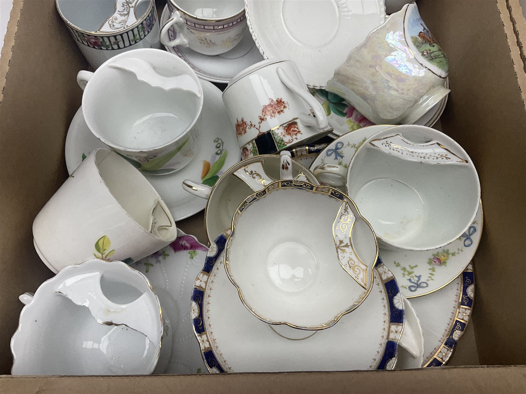 Collection of 19th century and later moustache cups, mostly with matching saucers, including hand painted examples