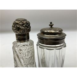 Edwardian silver mounted purse, with circular panel engraved with initials, and hammered finish, hallmarked William Comyns & Sons, London 1903, H14cm, together with three dressing table glass jars with hallmarked silver covers, and a hallmarked silver mounted buffer 